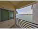 Balcony with water views and wooden flooring at 4625 Mirabella Ct, St Pete Beach, FL 33706