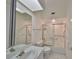 Clean bathroom with shower/tub combo and grab bars at 4625 Mirabella Ct, St Pete Beach, FL 33706