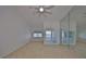 Spacious bedroom with water views and mirrored wall at 4625 Mirabella Ct, St Pete Beach, FL 33706