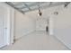 Attached garage with epoxy flooring at 4625 Mirabella Ct, St Pete Beach, FL 33706