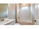 Simple bathroom with single vanity, shower/tub combo, and window at 5208 Savino Cir, Palmetto, FL 34221