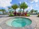 Circular hot tub surrounded by palm trees at 5208 Savino Cir, Palmetto, FL 34221