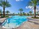 Relaxing resort-style pool with lounge chairs and umbrellas at 5208 Savino Cir, Palmetto, FL 34221