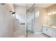 Large walk-in shower with neutral tile and built-in shower seat at 5208 Savino Cir, Palmetto, FL 34221