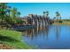 Stone water feature with archways and pond at 5208 Savino Cir, Palmetto, FL 34221