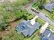 An aerial view of a house with a pool and large backyard at 5253 Mira Vista Dr, Palm Harbor, FL 34685