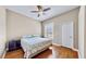 Well-lit bedroom with hardwood floors and a ceiling fan at 5253 Mira Vista Dr, Palm Harbor, FL 34685