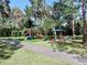 Community playground with play structures and shaded areas at 5253 Mira Vista Dr, Palm Harbor, FL 34685