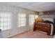 Bedroom with wooden framed bed and window at 5341 Mary St, Zephyrhills, FL 33542