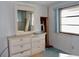 Bedroom with dresser and mirror, carpeted floor at 5341 Mary St, Zephyrhills, FL 33542