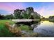 Bohemian Golf Club sign by the lake at sunset at 5341 Mary St, Zephyrhills, FL 33542