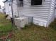 Side view of mobile home showing exterior AC unit at 5341 Mary St, Zephyrhills, FL 33542