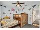 bedroom with bunk bed, ocean-themed decor, and access to hall at 5716 Colony Glen Rd, Lithia, FL 33547