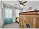 bedroom with built-in bunk bed, ocean-themed decor, and ceiling fan at 5716 Colony Glen Rd, Lithia, FL 33547