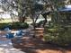 Community fire pit and seating area overlooking lake at 5716 Colony Glen Rd, Lithia, FL 33547