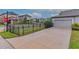 Townhouse exterior with driveway and black metal fence at 5716 Colony Glen Rd, Lithia, FL 33547