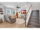 Open living room with hardwood floors and a staircase at 5716 Colony Glen Rd, Lithia, FL 33547