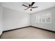 Spacious bedroom with ceiling fan and wood-look floors at 5809 Cruiser Way, Tampa, FL 33615