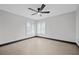 Well-lit bedroom with wood-look floors and ceiling fan at 5809 Cruiser Way, Tampa, FL 33615