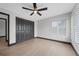 Bright bedroom with dark wood doors and plantation shutters at 5809 Cruiser Way, Tampa, FL 33615