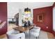 Modern dining room with an elegant chandelier, a statement mirror, and an open layout connecting to the kitchen at 5809 Cruiser Way, Tampa, FL 33615