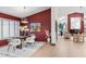 Elegant dining room with a rich burgundy wall and modern light fixture at 5809 Cruiser Way, Tampa, FL 33615