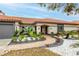 Home exterior showcasing a brick walkway and well-manicured landscaping at 5809 Cruiser Way, Tampa, FL 33615