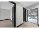 Hallway with view of the pool through sliding glass doors at 5809 Cruiser Way, Tampa, FL 33615