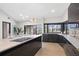 Modern kitchen with sleek dark cabinetry and a large island at 5809 Cruiser Way, Tampa, FL 33615