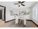 Home office featuring a white desk and chair, and large window with shutters at 5809 Cruiser Way, Tampa, FL 33615