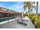 Relaxing pool deck with lounge chairs, overlooking a refreshing pool and lush landscaping at 5809 Cruiser Way, Tampa, FL 33615