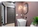 Contemporary powder room featuring a unique sink and mirror at 5809 Cruiser Way, Tampa, FL 33615