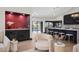 Modern wet bar with red tile backsplash and dark cabinetry at 5809 Cruiser Way, Tampa, FL 33615