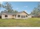 House backyard view with green grass and storage shed at 5915 29Th Avenue E Dr, Bradenton, FL 34208