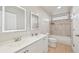 Bathroom with double vanity, shower, and toilet at 5915 29Th Avenue E Dr, Bradenton, FL 34208