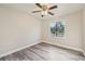 Bedroom with grey vinyl flooring and ceiling fan at 5915 29Th Avenue E Dr, Bradenton, FL 34208