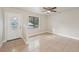 Living room with tile floors and ceiling fan at 5915 29Th Avenue E Dr, Bradenton, FL 34208