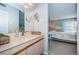 Bathroom with vanity, mirror and view of bedroom at 6051 Sun Blvd # 207, St Petersburg, FL 33715