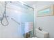 Walk-in shower with grab bar and tiled walls at 6051 Sun Blvd # 207, St Petersburg, FL 33715