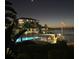 Night view of waterfront property with pool and patio area at 6051 Sun Blvd # 207, St Petersburg, FL 33715