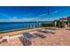 Tranquil waterfront patio with lounge chairs for sunbathing at 6051 Sun Blvd # 207, St Petersburg, FL 33715