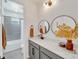 Modern bathroom with gray cabinets, quartz countertop, and double vanity at 6137 Voyagers Pl, Apollo Beach, FL 33572