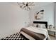 Well-lit bedroom with a cozy bed and stylish wall art at 6137 Voyagers Pl, Apollo Beach, FL 33572