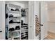 Well-organized closet with shelves, rods, and shoe storage at 6137 Voyagers Pl, Apollo Beach, FL 33572