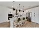 Modern kitchen with white cabinets, stainless steel appliances, and a large island at 6137 Voyagers Pl, Apollo Beach, FL 33572