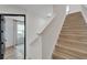 Upstairs hallway with light wood stairs and access to bedrooms at 6137 Voyagers Pl, Apollo Beach, FL 33572