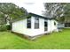 White single-story house with a blue trim at 6141 Ridgewood Dr, Zephyrhills, FL 33542