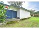 White single-story house with a covered porch and a grassy yard at 6141 Ridgewood Dr, Zephyrhills, FL 33542