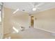 Bright bedroom with ceiling fan and access to hallway at 6151 Silver Oaks Dr, Zephyrhills, FL 33542