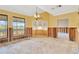 Dining room under renovation with damaged walls and floors at 6151 Silver Oaks Dr, Zephyrhills, FL 33542